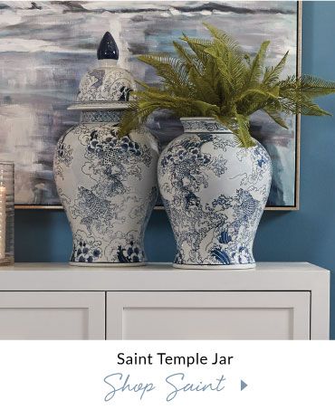 Classic ocean spray and koi scene are depicted on the elegant proportions of this porcelain temple jar