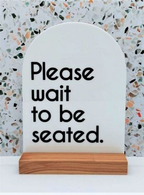 SIGN - PLEASE WAIT TO BE SEATED WHT ARCH