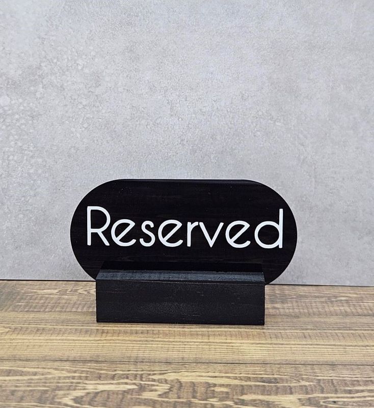 RESERVED SIGN OVAL BLACK W/BASE 90X50MM