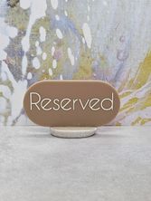 RESERVED SIGN OVAL BROWN W/STONE BASE