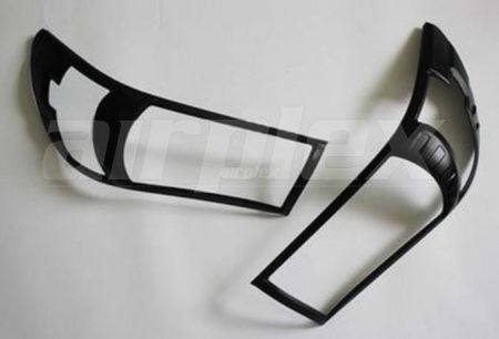 HEADLIGHT TRIM SET BLACK HILUX (NOT LED LIGHT)