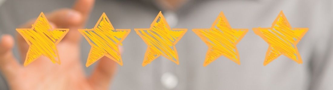 Hand reaching for 5 gold stars