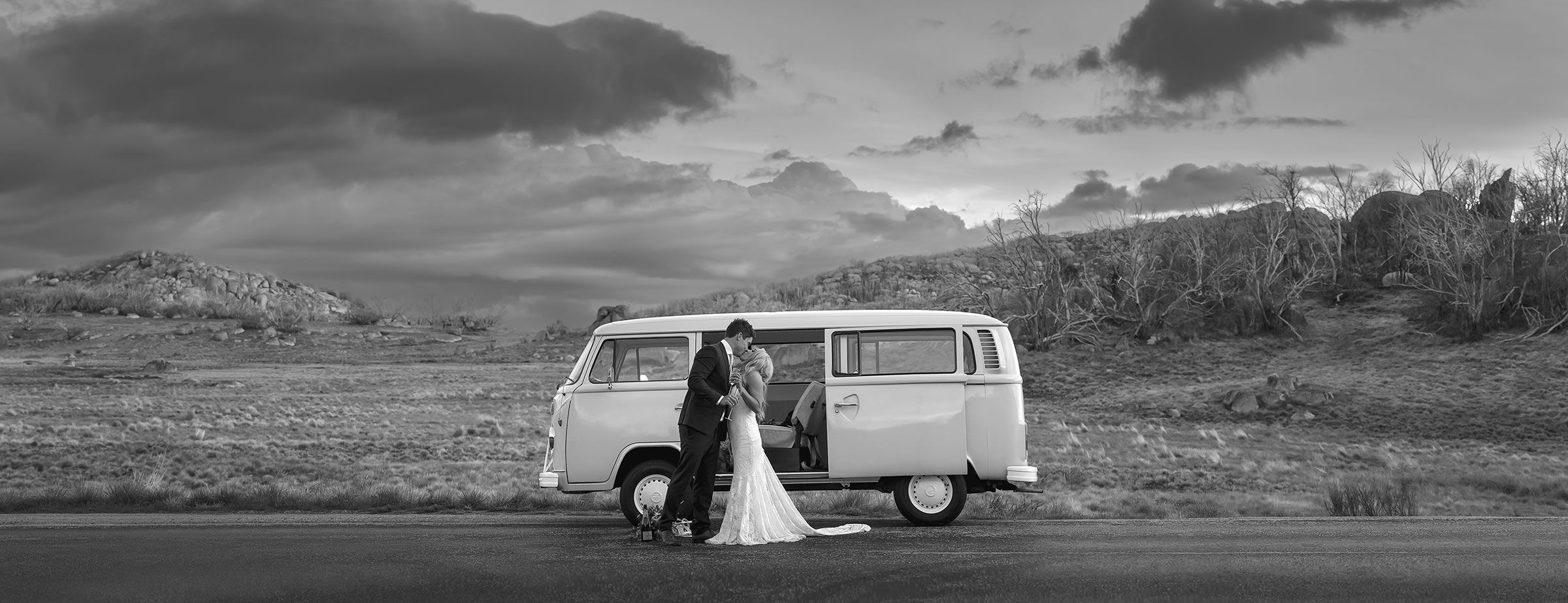 Couple in front of old VW Transporter at Mt Buffalo