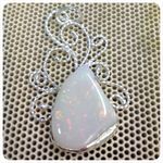 Silver pendant set with opal