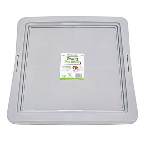 Training pad outlet tray