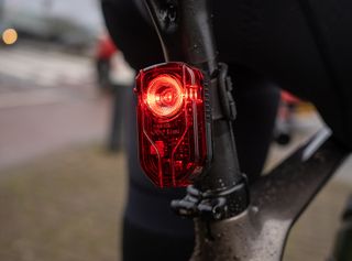 A NEW ITEM - REAR LIGHT, High intensity  100 Lumen, 3 function High / Low / Flash,  w/bracket & USB cable, USB rechargeable battery built in