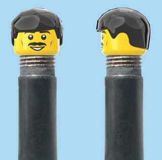 `A NEW ITEM  -  VALVE CAP, A/V, moustache, smile, short black hair, sold in pairs