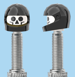 `A NEW ITEM  -  VALVE CAP, F/V, skull, black full face helmet, sold in pairs