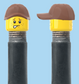 `A NEW ITEM  -  VALVE CAP, A/V, freckles, smile & worried look, brown hat, sold in pairs