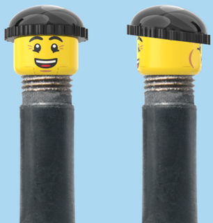 `A NEW ITEM  -  Brick Caps - Schrader Valve - 2 Face Head (Bursting Cheeks & Wrinkle Eye Smile) with a Black Beanie