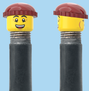 `A NEW ITEM  -  Brick Caps - Schrader Valve - 2 Face Head (Bursting Cheeks & Wrinkle Eye Smile) with a Brown Beanie