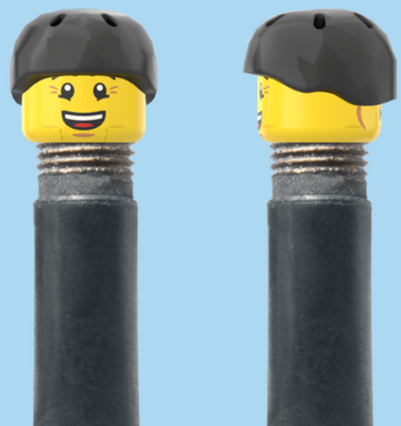 `A NEW ITEM  -  Brick Caps - Schrader Valve - 2 Face Head (Bursting Cheeks & Wrinkle Eye Smile) with a Black Helmet