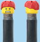 `A NEW ITEM  -  Brick Caps - Schrader Valve - 2 Face Head (Worried Look & Half Smile) with a Red Helmet