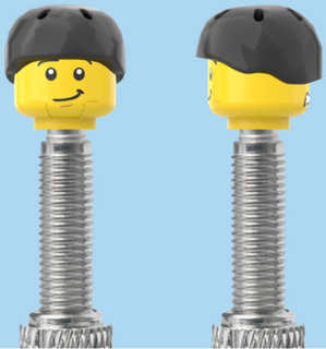 `A NEW ITEM  -  Brick Caps - Presta Valve - 2 Face Head (Worried Look & Half Smile) with a Black Helmet