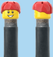 `A NEW ITEM  -  Brick Caps - Schrader Valve - 2 Face Head (Freckles Smile & Freckles Worried Look) with a Red Helmet