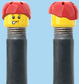 `A NEW ITEM  -  Brick Caps - Schrader Valve - 2 Face Head (Freckles Smile & Freckles Worried Look) with a Red Helmet
