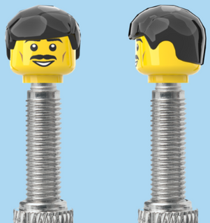 `A NEW ITEM  -  Brick Caps - Presta Valve - 1 Face Head (Moustache Smile) with a Black Fringe Hairdo