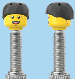 `A NEW ITEM  -  Brick Caps - Presta Valve - 2 Face Head (Bursting Cheeks & Wrinkle Eye Smile) with a Black Helmet