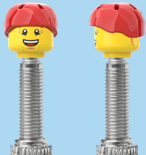 `A NEW ITEM  -  Brick Caps - Presta Valve - 2 Face Head (Bursting Cheeks & Wrinkle Eye Smile) with a Red Helmet