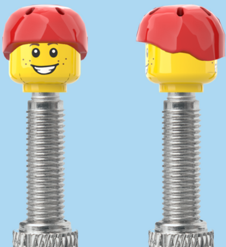 `A NEW ITEM  -  Brick Caps - Presta Valve - 2 Face Head (Freckles Smile & Freckles Worried Look) with a Red Helmet