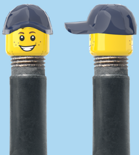 `A NEW ITEM  -  Brick Caps - Schrader Valve - 2 Face Head (Freckles Smile & Freckles Worried Look) with a Blue Cap