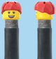 `A NEW ITEM  -  Brick Caps - Schrader Valve - 2 Face Head (Bursting Cheeks & Wrinkle Eye Smile) with a Red Helmet