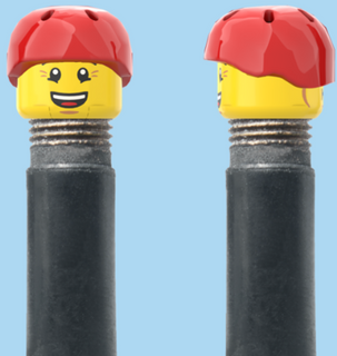 `A NEW ITEM  -  Brick Caps - Schrader Valve - 2 Face Head (Bursting Cheeks & Wrinkle Eye Smile) with a Red Helmet