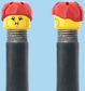 `A NEW ITEM  -  Brick Caps - Schrader Valve - 2 Face Head (Bursting Cheeks & Wrinkle Eye Smile) with a Red Helmet