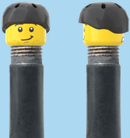 `A NEW ITEM  -  Brick Caps - Schrader Valve - 2 Face Head (Worried Look & Half Smile) with a Black Helmet