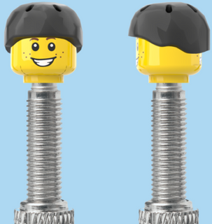 `A NEW ITEM  -  Brick Caps - Presta Valve - 2 Face Head (Freckles Smile & Freckles Worried Look) with a Black Helmet