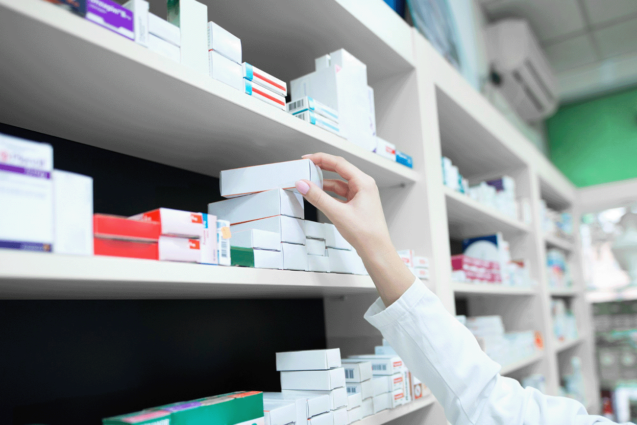 closeup-view-pharmacist-hand-taking-medicine-box-from-shelf-drug-store-s.png