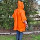 Premium Emergency Poncho -  Premium weight - Usually Disposable but can be reused 
one size fits most - Orange outside for visibility - Silver inside to help retain body warmth