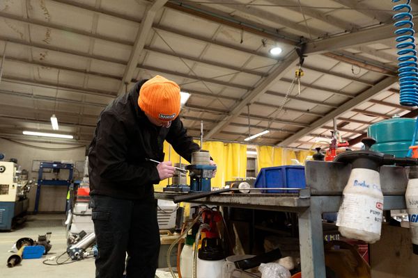 Ian fixing pump in workshop