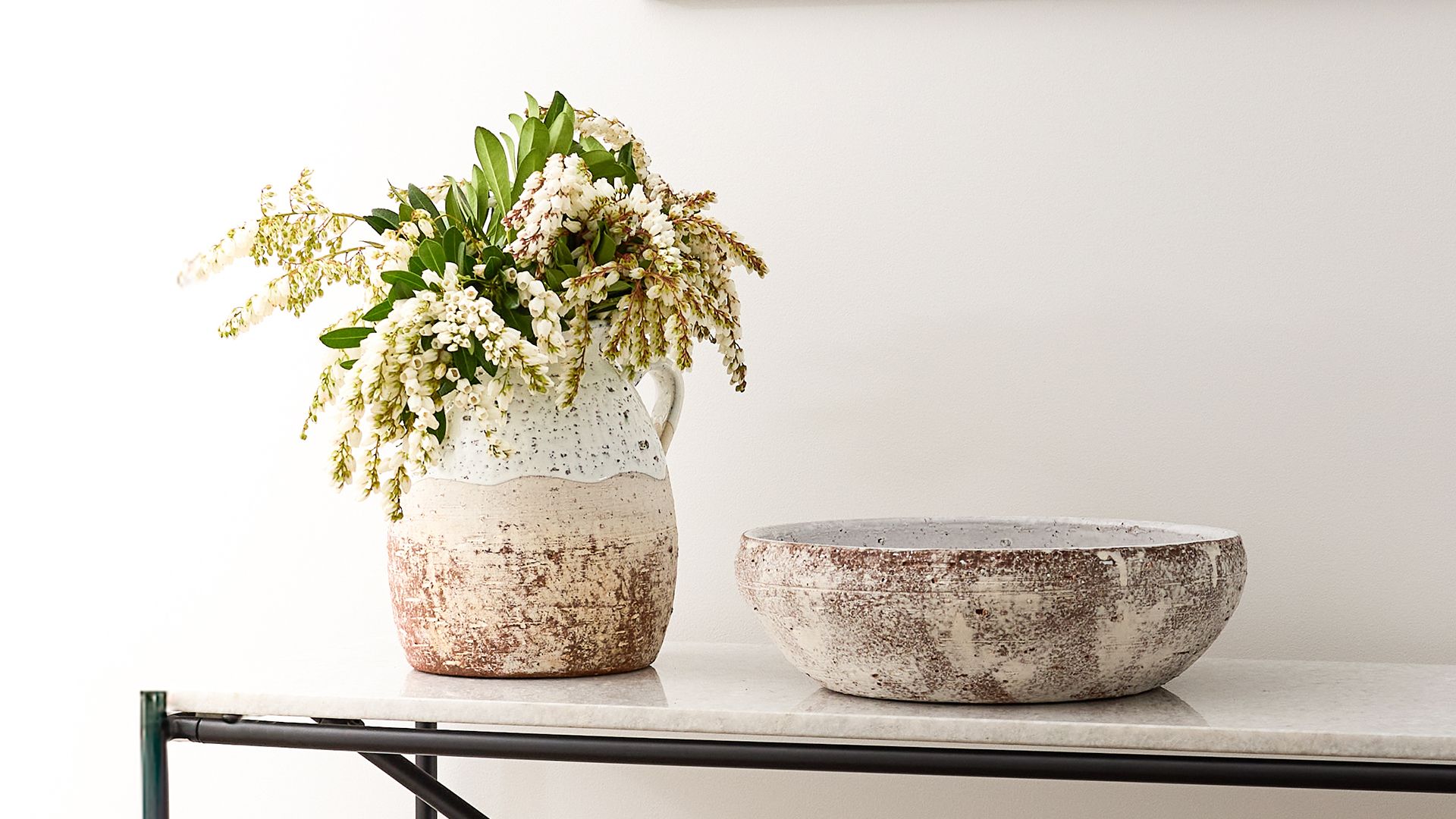 <h2>New Season Terracotta</h2><button>Explore Now</button>