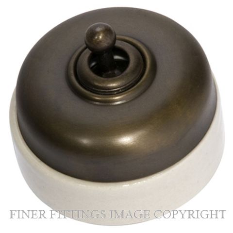 TRADCO 5105 IVORY PORCELAIN BASE SWITCH ANTIQUE BRASS