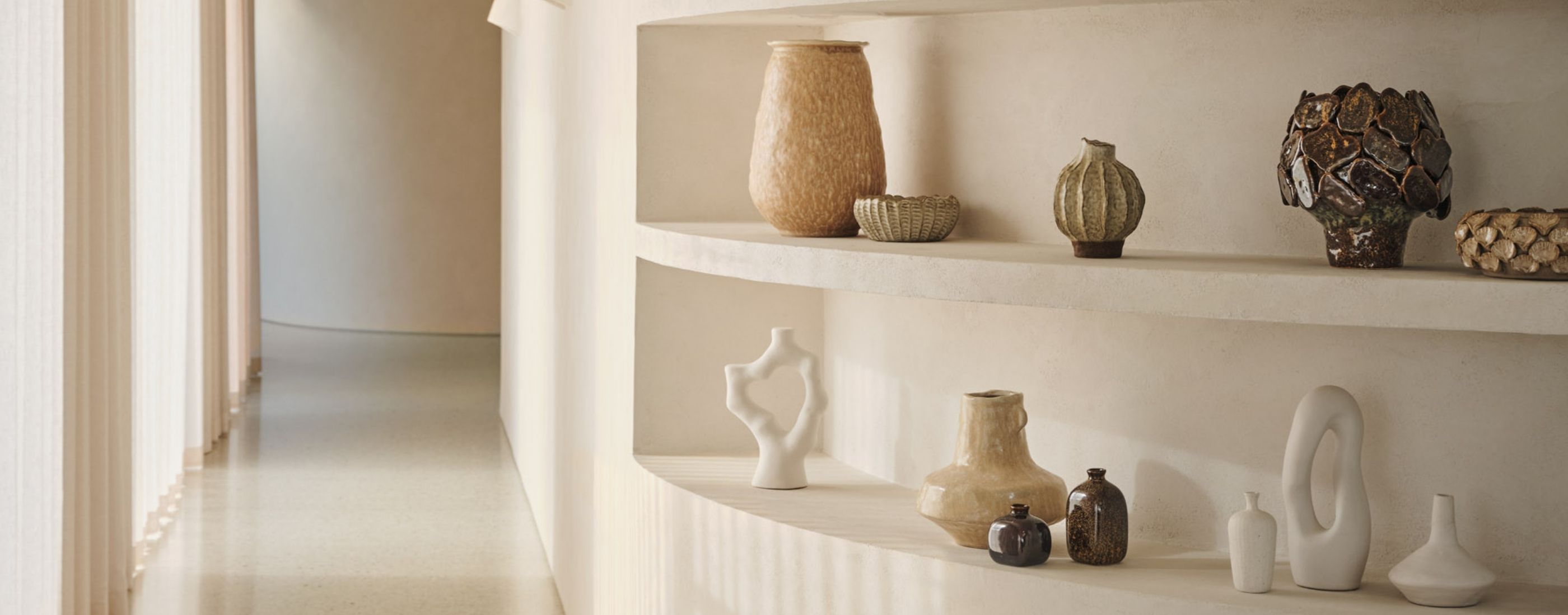 <div class='slider-left'><span>SPRING SUMMER 2025</span><h2>ART OF THE VASE</h2><a href='#' class='btn'>Explore</a></div>