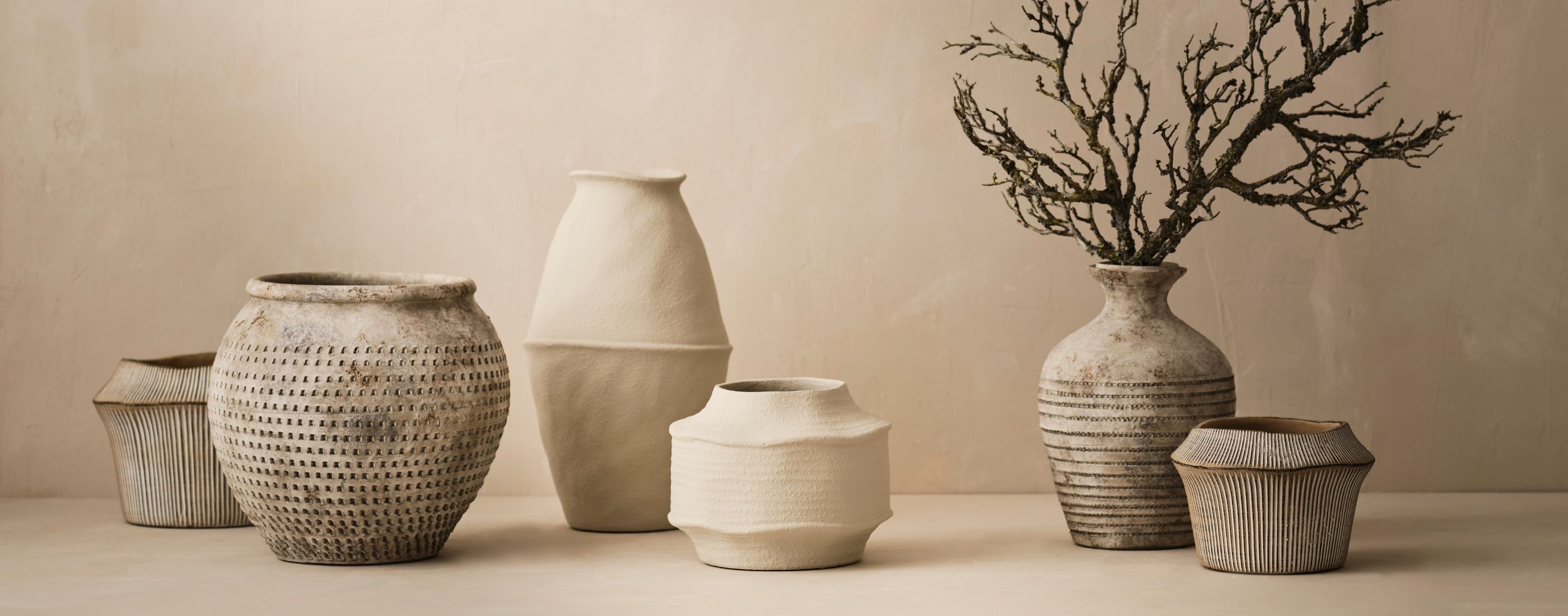 <div class='slider-center'><span>SPRING SUMMER 2025</span><h2>SUNLIT STYLE</h2><a href='#' class='btn'>Explore</a></div>