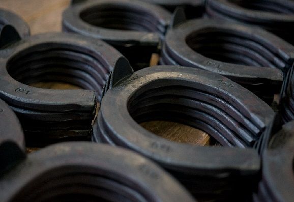 Collection of steel horseshoes with toe-clips