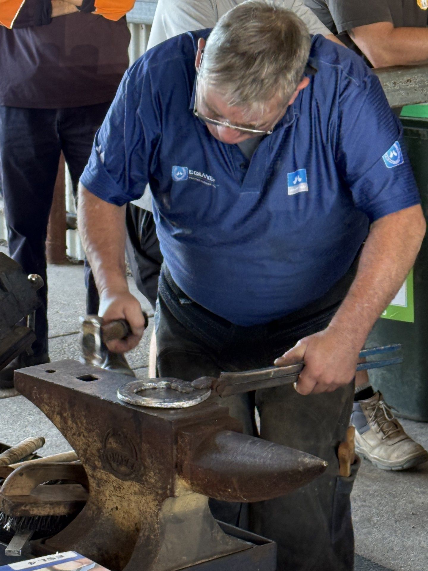 Dean Lewis making a horseshoe on anvil