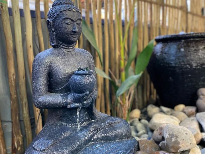 Buddha sculpture with running water