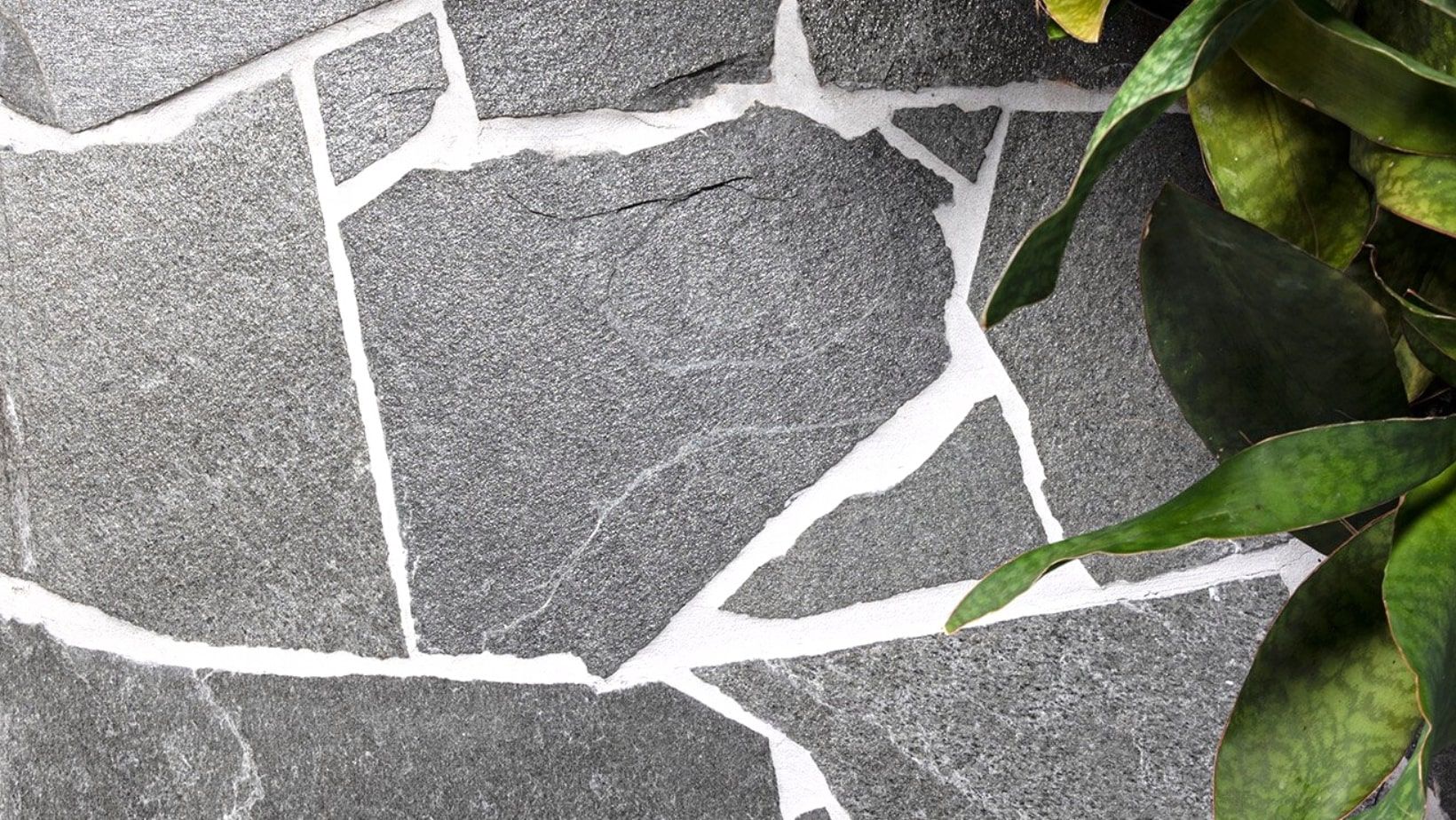 Crazy paving with natural stone and plants