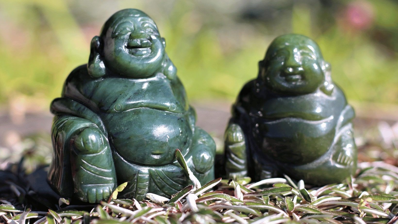 Two hand carved jade buddha 