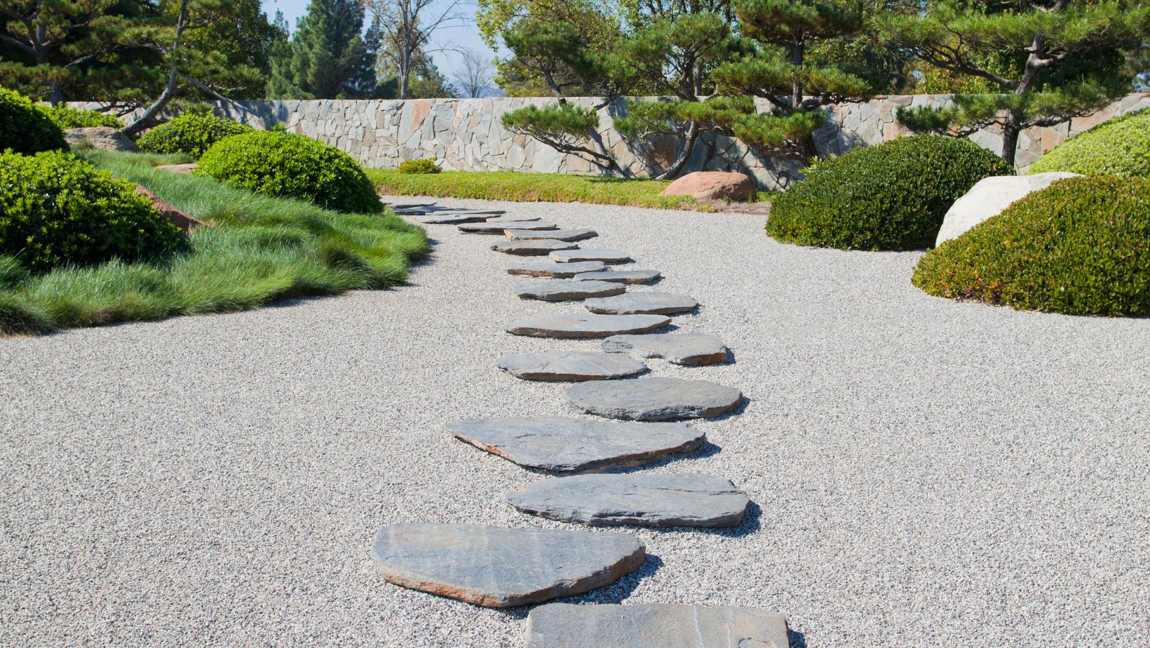 Stone and pebble pathway with garden