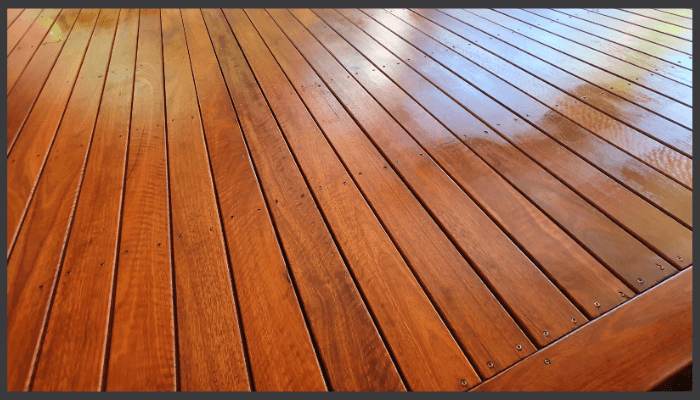 Glossy, well-maintained treated pine decking with clean board spacing and visible wood grain.