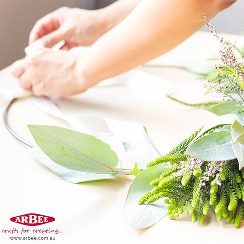 Woman making decorative wreath