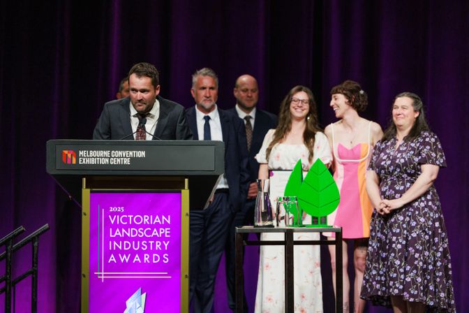 Collecting the 2025 Supplier of the year award on stage