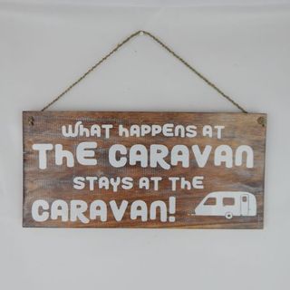 Sign "What happens in the caravan" 40cm x 20cm high